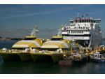 Fastcats Ryde and Shanklin which have been superseded by the new Wight Ryders. In the background is the car ferry St Clare, Wightlink's largest vessel.